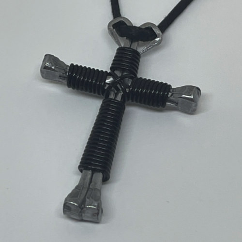 Nail cross necklace wrapped with bold black wire.