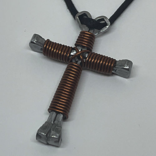 Nail cross necklace wrapped with bold brown wire.