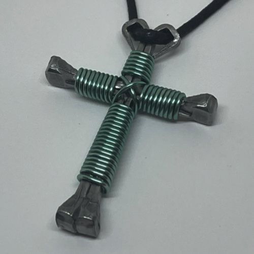 Nail cross necklace wrapped with bold baby blue wire.