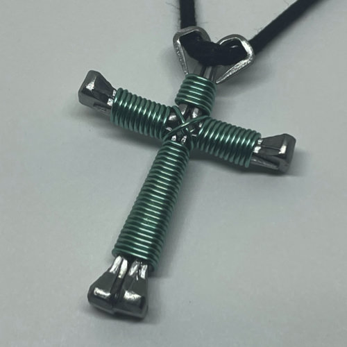 Small Nail cross wrapped with bold amethyst wire.